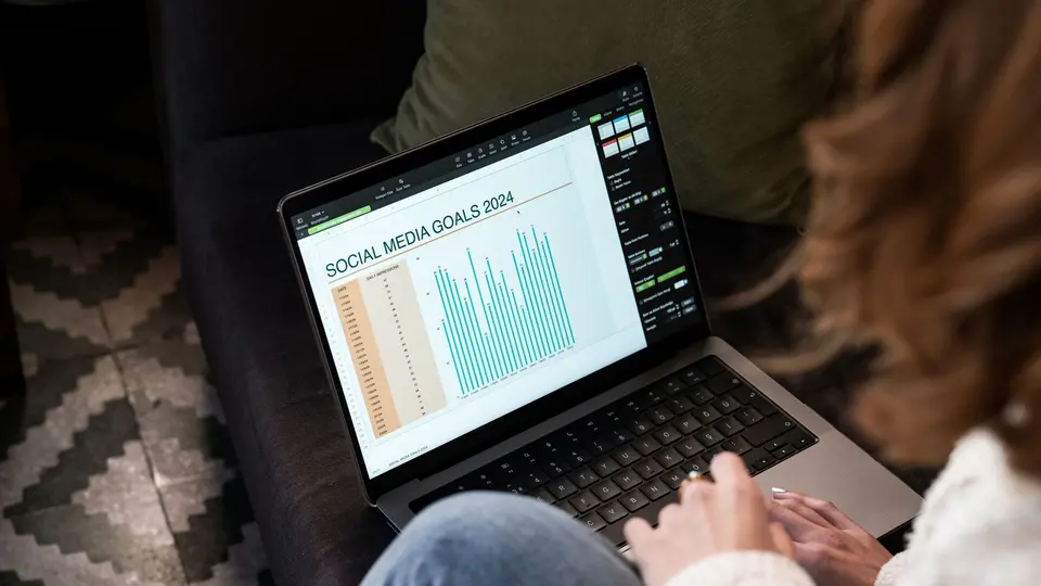 Cyber investigator using digital authenticity watermarking tool on laptop