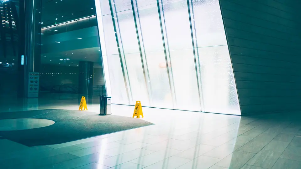 Minimalist tech company lobby with sleek branding and illuminated logo