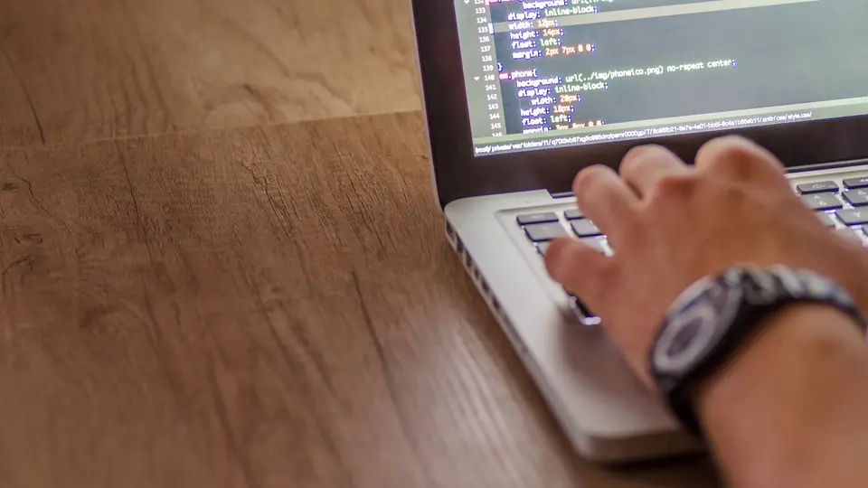 Cybersecurity engineer securing enterprise cloud network with hardware security key