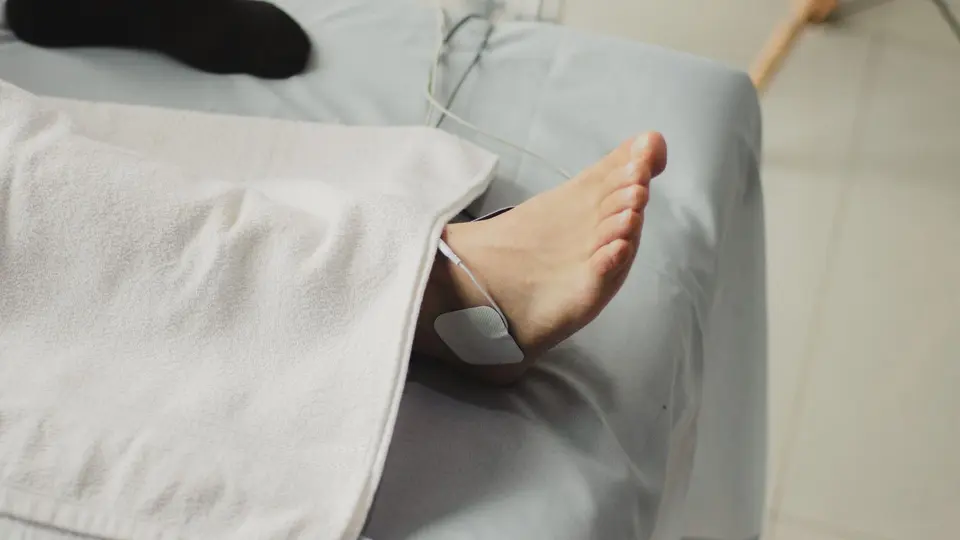 High-tech bedroom featuring red light therapy panel and sleep tracking sensor ring