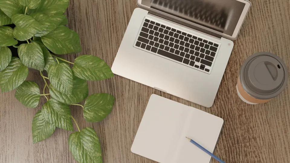 Aesthetic wooden workstation with mechanical keyboard, plant, and notebook
