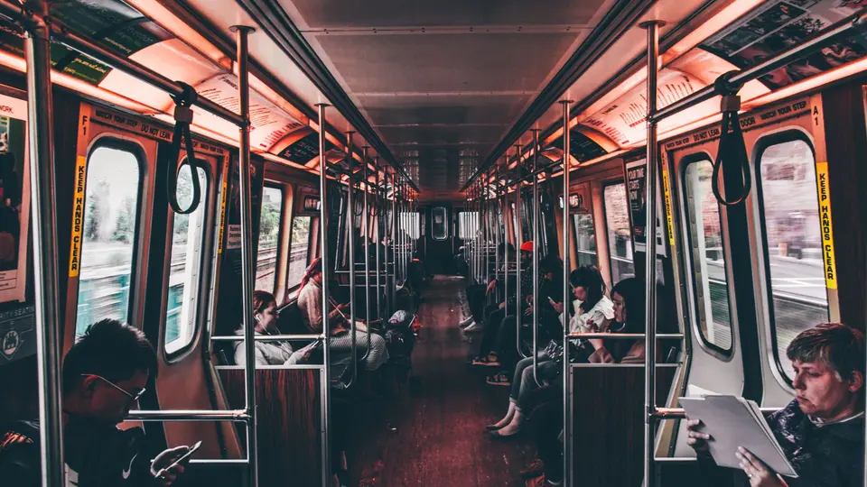 Crowded subway train during Monday morning rush hour commute with tired commuters