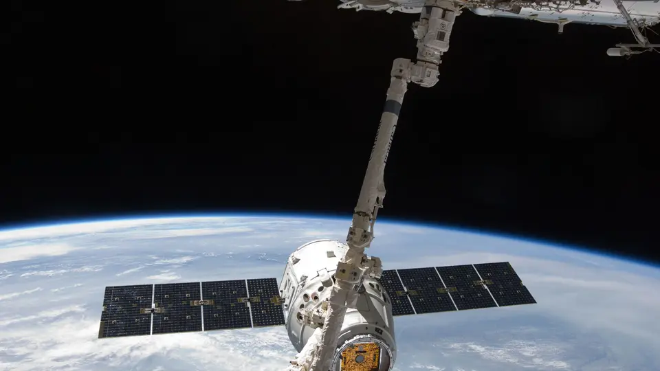 Robotic mining probe tethered to rocky asteroid core extracting rare earth minerals