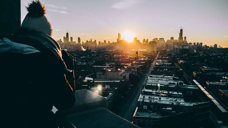 Chicago skyline at dawn with morning golden light reflecting on skyscrapers