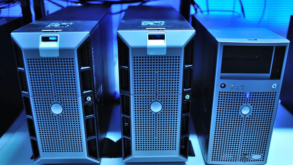 Supercomputer server room with glowing blue and green fiber optic cables