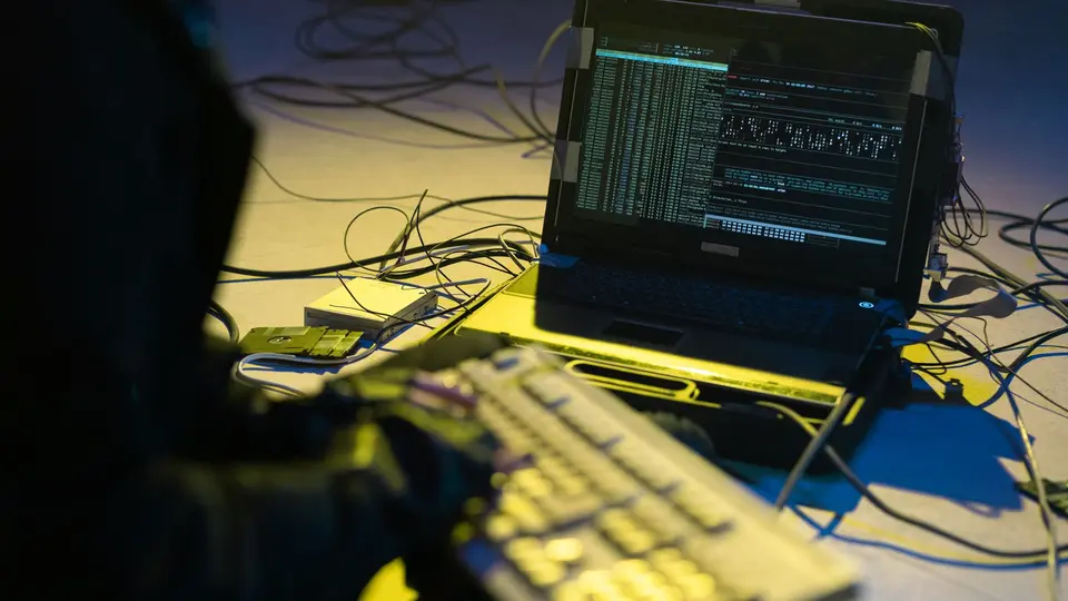 Cybersecurity engineer securing enterprise cloud network with hardware security key